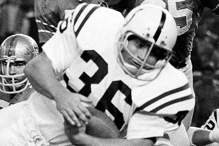 The CBS broadcasters for that Giants-Eagles game on Oct. 13, 1974, were intrigued by Norm Bulaich's unusual headgear. (Ed Kolenovsky/AP file photo)