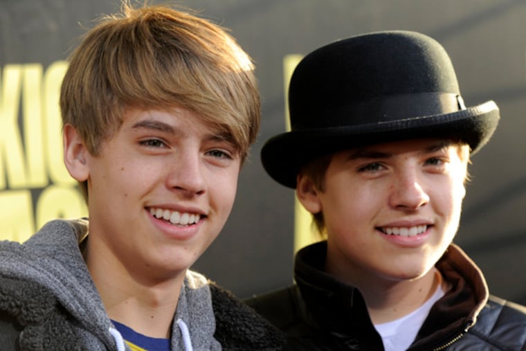 Brothers Cole, left, and Dylan Sprouse arrive at the premiere of the film "Kick-Ass" in Los Angeles, Tuesday, April 13, 2010. (AP Photo/Chris Pizzello)