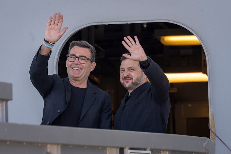 Britain's Prime Minister Andy Burnham (left) and Ukraine's President Volodymyr Zelenskyy visit HM Naval Base in Portsmouth, England, Monday July 27, 2026.