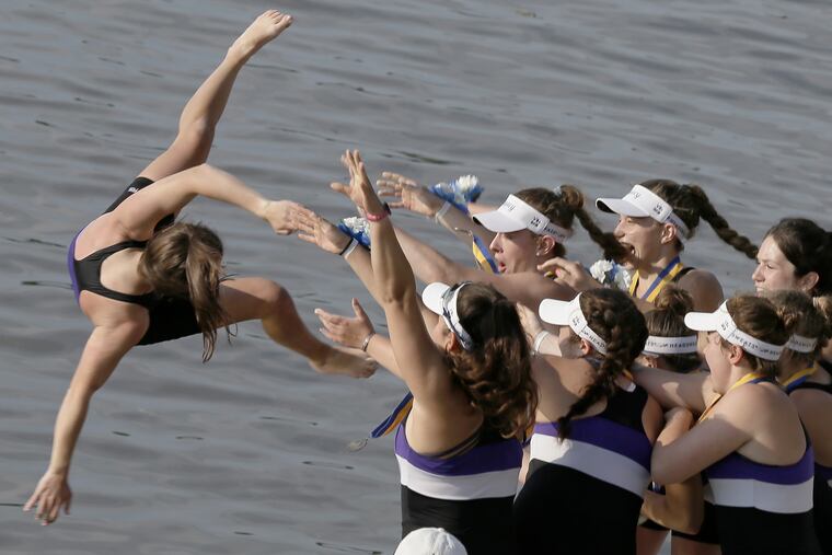 The Mount St. Joseph rowers celebrate their victory on Saturday at the Stotesbury Cup Regatta with the traditional tossing of team members into the Schuylkill.