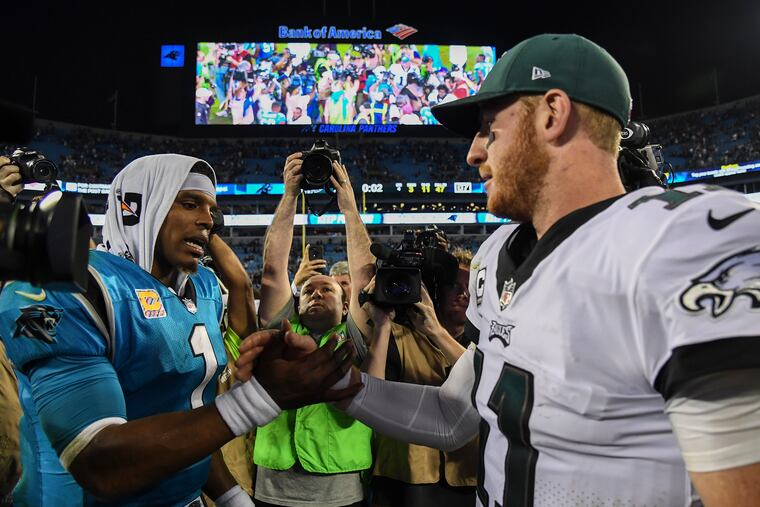 Panthers quarterback Cam Newton congratulates Carson Wentz after the Eagles' victory. Newton threw three interceptions. CLEM MURRAY / Staff Photographer