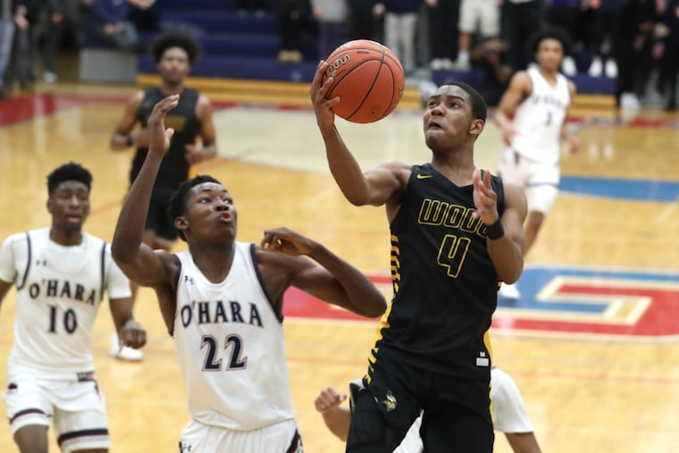 Jaylen Stinson of Archbishop Wood goes up for a basket against Solo Bambara of Cardinal O’Hara.