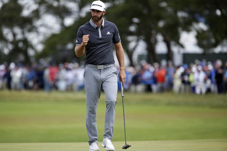 Dustin Johnson reacts after making a putt for birdie on the fourth green during the second round of the U.S. Open on Friday.