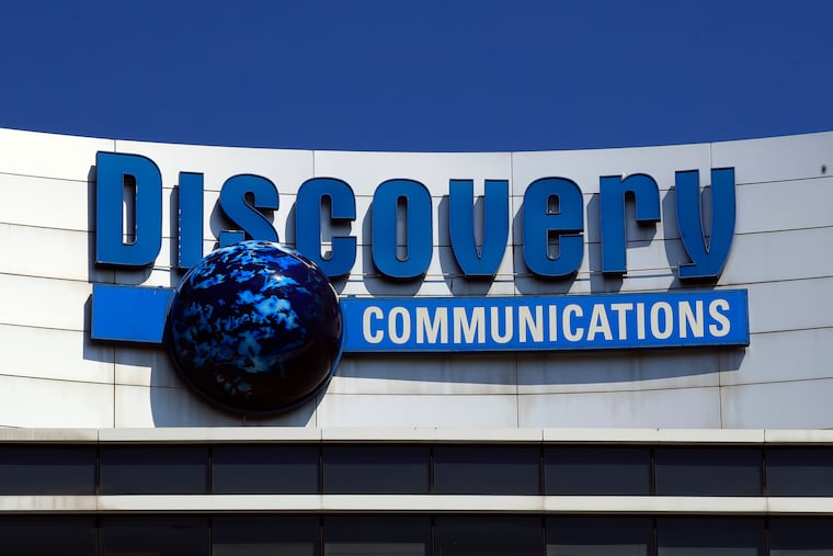 The Discovery Communications logo sits atop its headquarters in Silver Spring, Md., in 2017.
