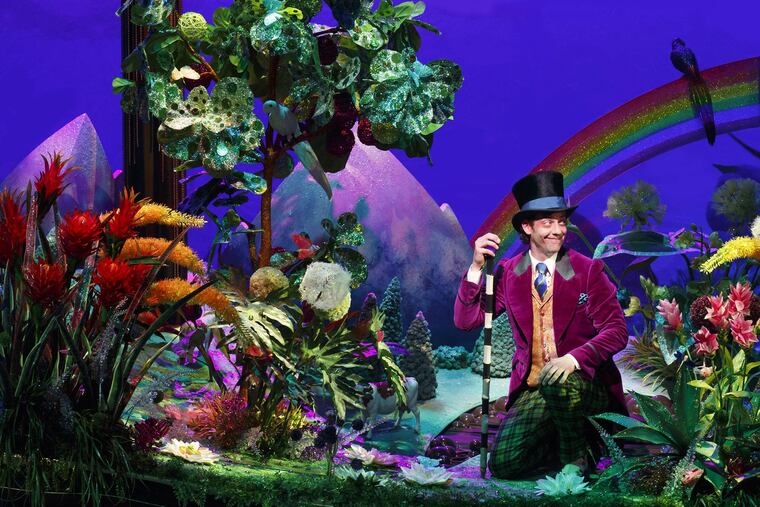 The actor Christian Borle playing Willie Wonka in Charlie and the Chocolate Factory. The Gold Ticket, a real scavenger hunt-like competition started by the founder of the Jelly Belly Candy Company, was meant to emulate that story by Roald Dahl.