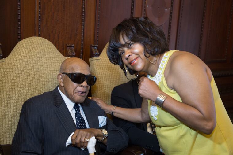 Philadelphia's Lynne Carter clowns around with International Boxing Federation president Bob Lee at her tribute ceremony Wednesday at City Hall.