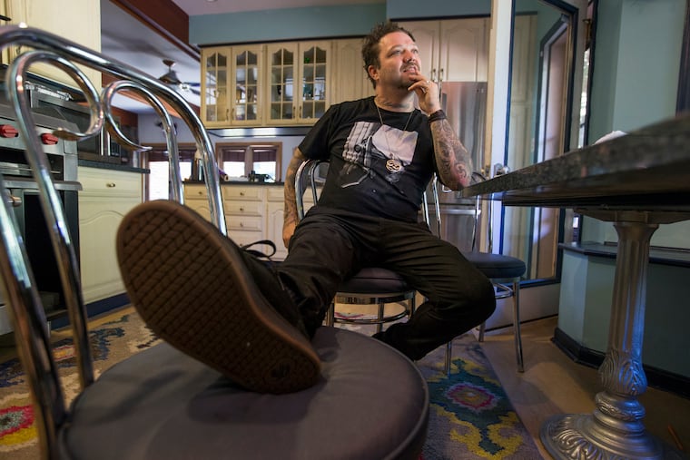 When Bam Margera's best friend and fellow Jackass star Ryan Dunn died in a fiery crash in West Goshen Township in 2011, he went into a deep, downward spiral. No one would ever argue that the West Chester resident had it all together, but he was making money and having fun, supposedly, living the perpetual Peter Pan life. It turns out that through much of Jackass, Bam was bulimic and drinking heavily and all of that got much worse after Dunn's death. He drank, a lot, got beat up and caused a scene wherever he went. Today he's lost weight, remarried and having a baby, and he's fallen back in love with skateboarding, the hobby that led him to fame from the beginning. He sits in his kitchen area. CHARLES FOX / Staff Photographer