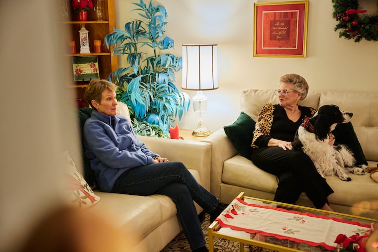 Sue Ronnenkamp (left) and her roommate, Sue Larsen, spend time together before going to a neighbor’s house for dinner in Denver.