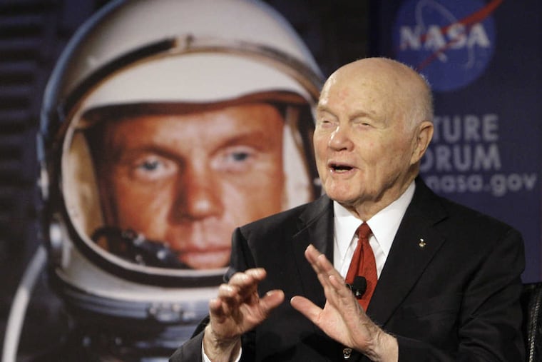In this Feb. 20, 2012, file photo, former Sen. John Glenn talks with astronauts on the International Space Station via satellite before a discussion titled "Learning from the Past to Innovate for the Future" in Columbus, Ohio.