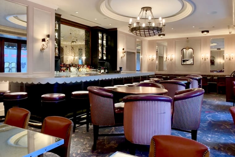 Rouge's new dining room has lost the drapery in favor of upholstered surfaces.