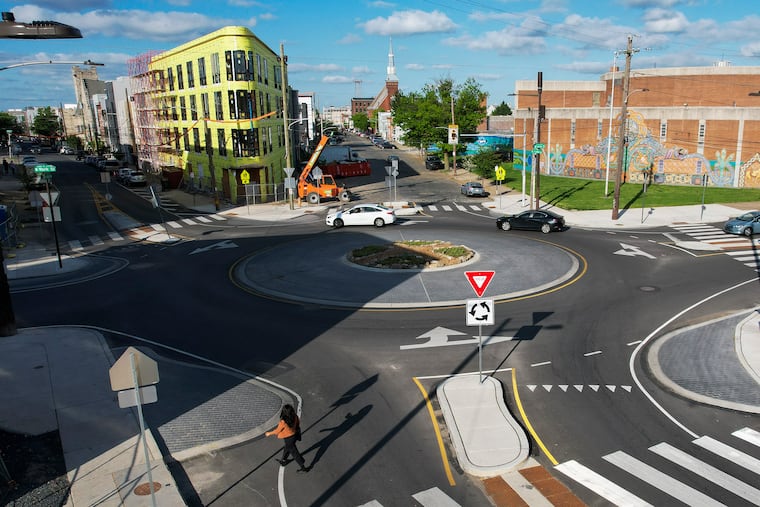 Pedestrians and cars at the roundabout at the intersections of York, Trenton and Frankford Ave. in the Fishtown section of Philadelphia.