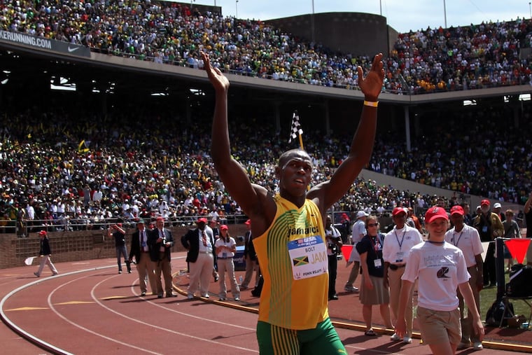 Jamaican runner Usain Bolt waves to his fans after running the final leg to win the 400 relay at the Penn Relays on Saturday afternoon, April 24, 2010.
