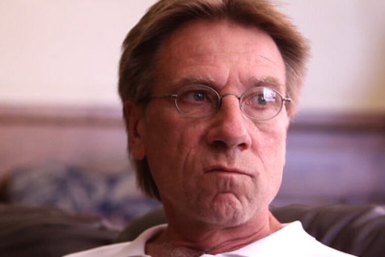 Dan Kane at St. Stanislaus Church. While in the smoldering office with arson investigators, Kane noticed that a large wall safe had been flung open in what looked like a robbery gone bad. (David Swanson /Staff Photographer)