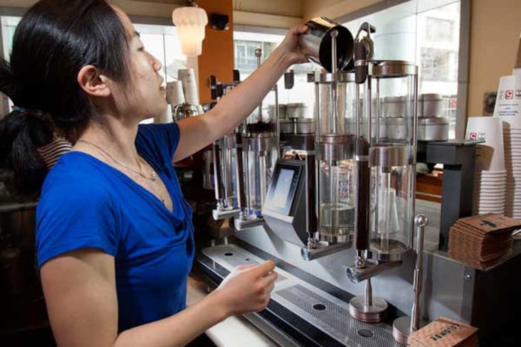 Barista Angie Chung works the Steampunk machine at La Colombe.