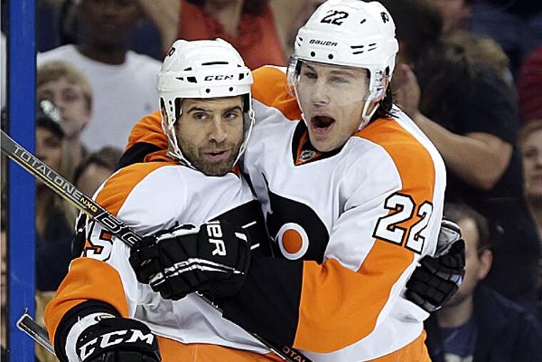 Flyers center Maxime Talbot celebrates with teammate defenseman Luke Schenn after scoring. (Chris O'Meara/AP)
