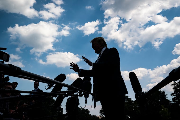 President Trump talks to reporters as he walks from the Oval Office to Marine One in July. Stephen Colbert dubbed the scrums "chopper talks."