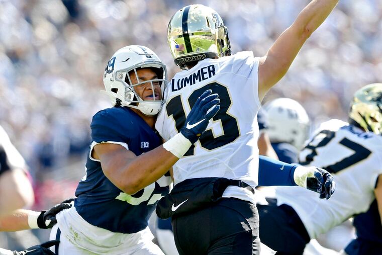 Penn State defensive end Yetur Gross-Matos, left, pressures Purdue quarterback Jack Plummer.