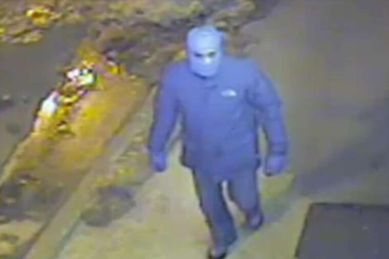 Surveillance video from outside Serrata's Grocery Store captures an image of a man who tried to hold up the store at gunpoint.