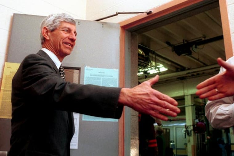 File Photo of Ted Erickson greeting voters at the entrance to Newtown Square Fire Co. 8 polling place. ( David Swanson / Staff photographer )