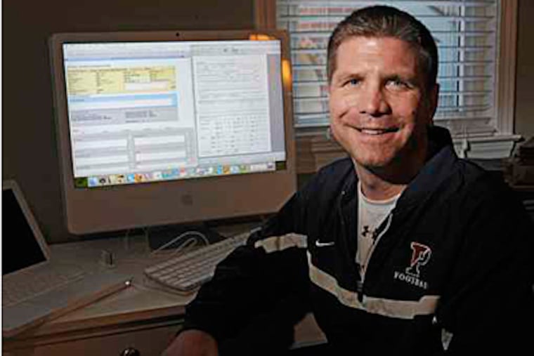Working from home, University of Penn dean of admissions Eric Furda reads one of the approximately 26,000 applications the school received this year. ( Clem Murray / Staff Photographer)
