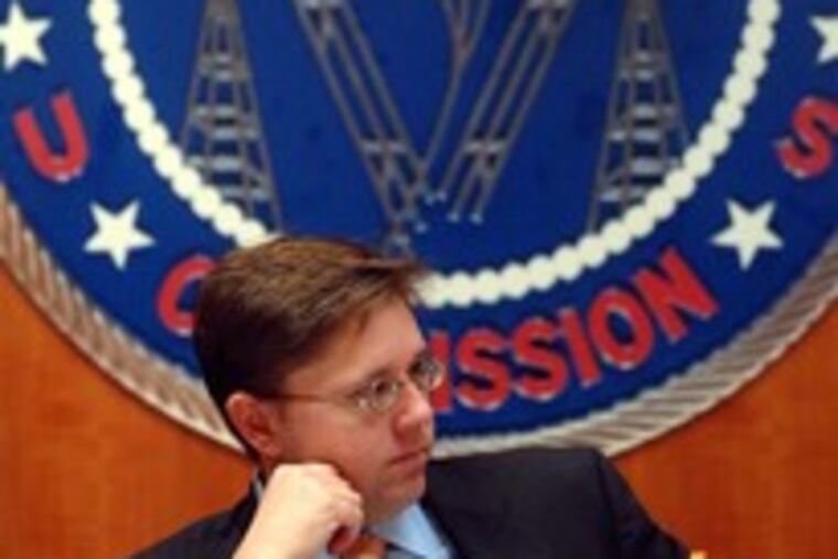 Kevin Martin , FCC chairman, at a hearing. He said a rule barring cable exclusivity in apartments would lower rates.