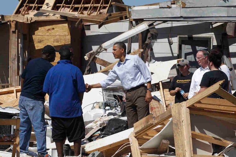 President Obama and Alabama Gov. Robert Bentley greet residents in the Alberta neighborhood of Tuscaloosa. "You have the right to cry," the city's mayor told one man. "And I can tell you the people of Tuscaloosa are crying with you." The death toll in seven states reached 329.