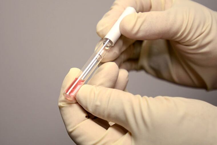 Sgt. Bob Bush holding Sirchie's Nark II Test Kit at Bensalem Police Department. Bucks County prosecutors will start presenting results of these tests as evidence at preliminary hearings. (VIVIANA PERNOT/Staff Photographer)