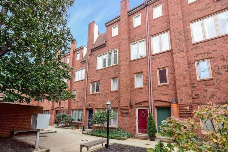 The two-bedroom unit includes one full bath and powder room. The family renovated both baths and the kitchen when they moved in.