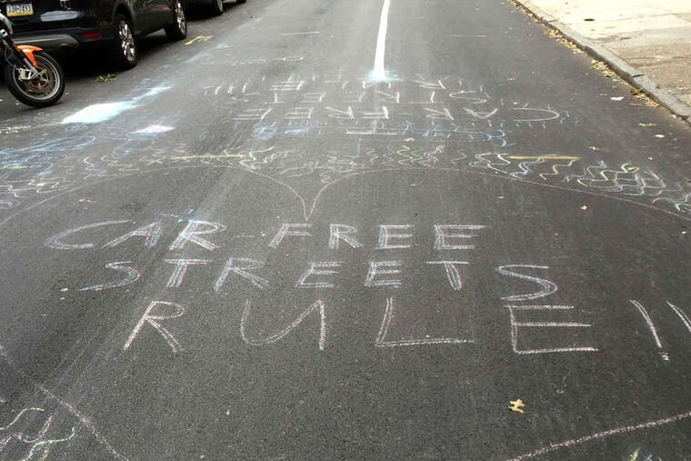 A show of love for no cars on the roads during pope weekend at 16th Street near Locust.