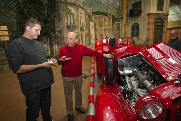 Frederick Simeone (right) speaks with Armando Lorenzo Munnet, who was visiting the museum.