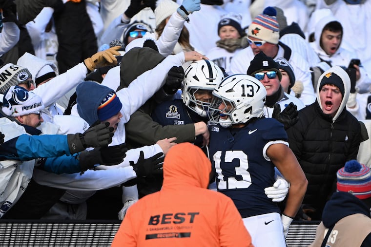 Penn State linebacker Tony Rojas celebrates an interception for a touchdown with Abdul Carter against SMU during the first half in the first round of the NCAA College Football Playoff on Saturday.