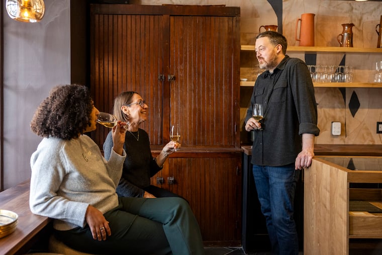 Owners Damien Graef (right) and Robyn Semien, (left) with general manager Patricia Jo Peacock at Lovat Square's wine shop.