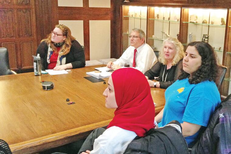 Temple president Neil Theobald (center) hears a presentation in a class he teaches that’s meant to improve campus life.