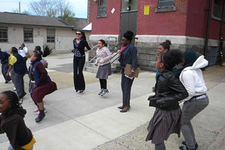 Students at Fitler Elementary School in Philadelphia jump to simulate an earthquake.