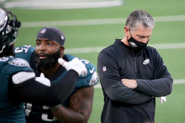 Eagles defensive coordinator Jim Schwartz (right) walks the sideline after the Cowboys scored in the second quarter last Sunday. Will Schwartz return for a sixth season?