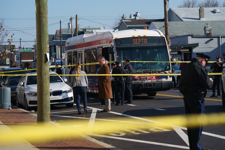 Crime scene tape cordons off a section of roadway at Torresdale Avenue and Howell Street in Wissinoming, where a Philadelphia Police officer was shot Thursday.