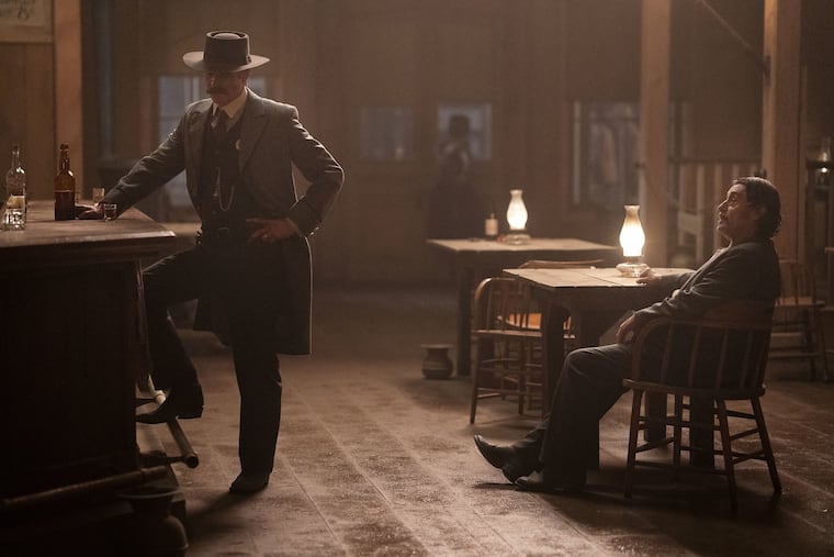 Timothy Olyphant (left) and Ian McShane in a scene from HBO's "Deadwood: The Movie," which premieres on Friday, May 31.