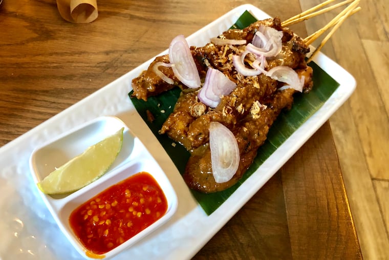 The chicken satay at D'Jakarta Cafe is similar to what chef Carerina Ho sold at her restaurants back home in Indonesia.