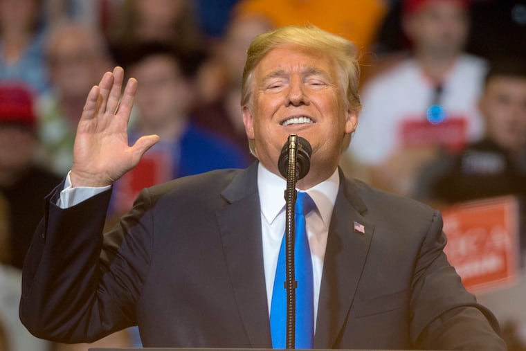 President Trump appears at a campaign rally for U.S. Rep. Lou Barletta at the Mohegan Sun Arena in Wilkes-Barre August 2, 2018.