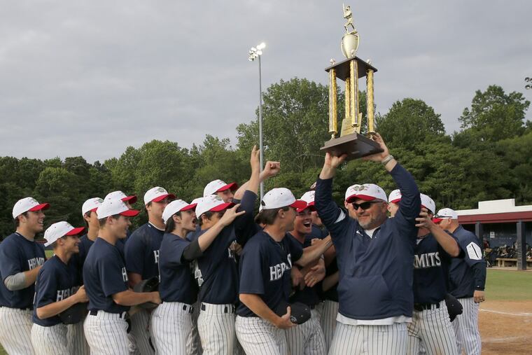 St. Augustine Prep coach Mike Bylone holds up at the 44th annual Diamond Classic championship trophy after last season’s title-game win over Gloucester Catholic.