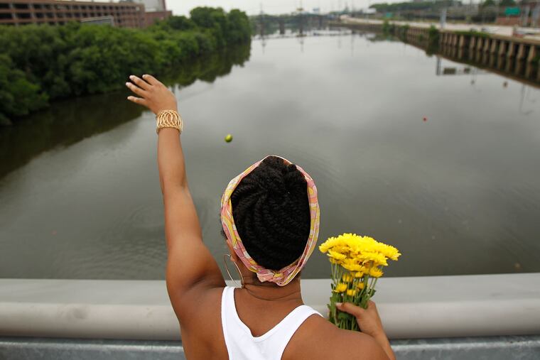 The high point of Odunde is a procession to the South Street Bridge over the Schuylkill to bring offerings of fruit, flowers, an dother items to Oshun, the deity of fresh water, beauty, and love. This is the 2011 festival. (DAVID MAIALETTI / Staff Photographer)