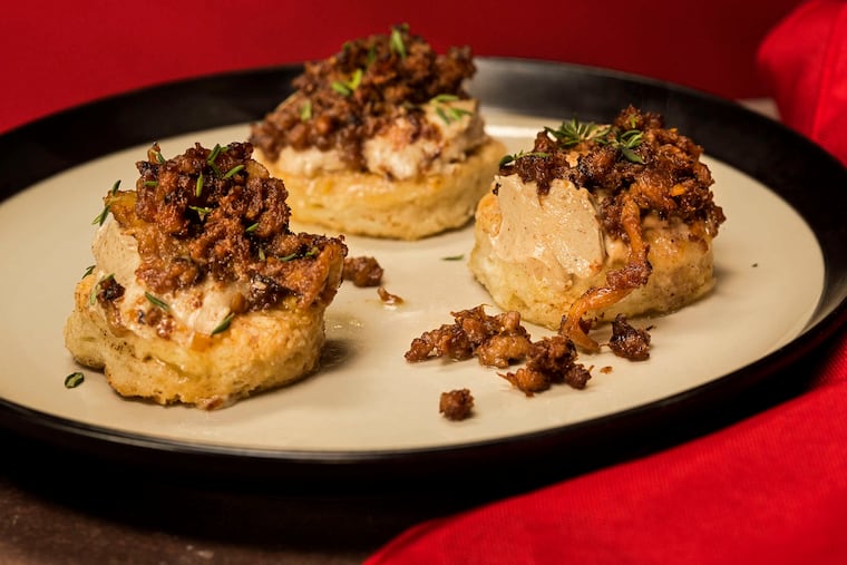 Brown butter biscuits topped with "bird funk" and chicken liver butter by chef Marcus Samuelsson.