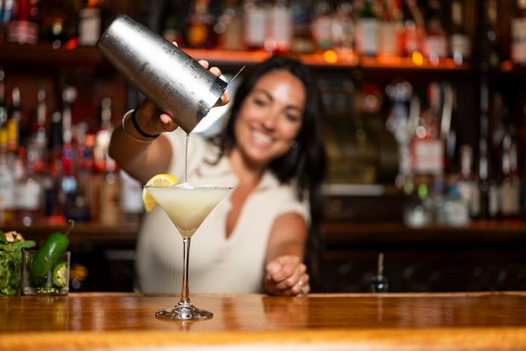 Gigi Bello, bar manager at Saloon, pours an Iceberg martini.