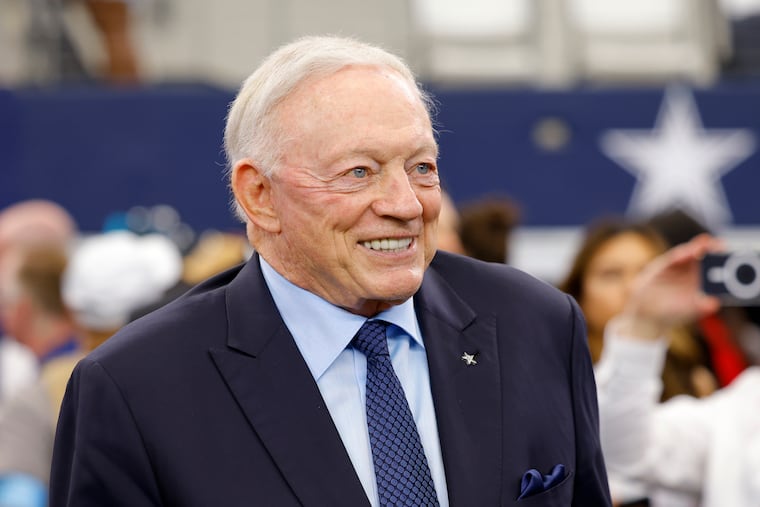 Dallas Cowboys team owner Jerry Jones stands on the field during warmups before his team was obliterated by the Detroit Lions.
