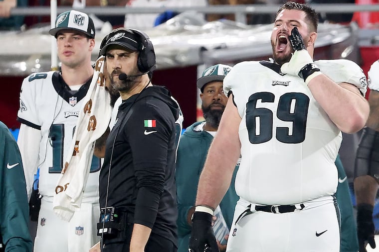 Philadelphia Eagles guard Landon Dickerson (right) yells from the sideline as Philadelphia Eagles head coach Nick Sirianni looks on during the wild-card round of the NFL playoffs against the Buccaneers at Raymond James Stadium in Tampa, Fl. on Monday, Jan. 15, 2024.