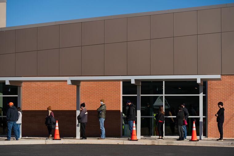 People waited to vote in the Georgia Senate runoff elections at North Cobb Regional Library in Kennesaw on Friday.