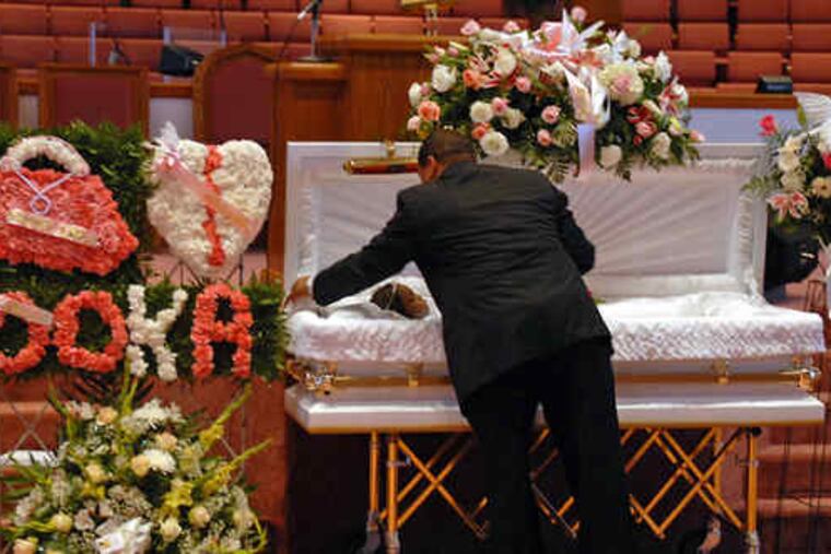 Funeral director Ricky Rivera Sr. (above) readies Aaliyah Griffin's casket before yesterday's viewing. (Below) her mother, Kaillalah Griffin; stepfather, Teddy Griffin (right), and father, Frank Savage.