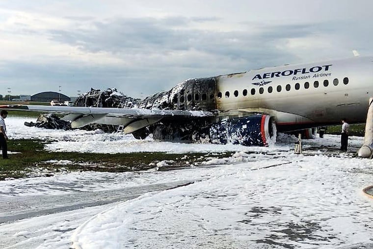 The Sukhoi SSJ100 aircraft of Aeroflot airlines is covered in fire retardant foam after an emergency landing in Sheremetyevo airport in Moscow on Sunday.