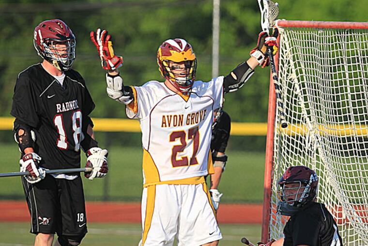 Bryce Reid of Avon Grove celebrates his goal in front of Clayton Proctor and goalie Alex Andersen of Radnor. (Charles Fox/Staff Photographer)