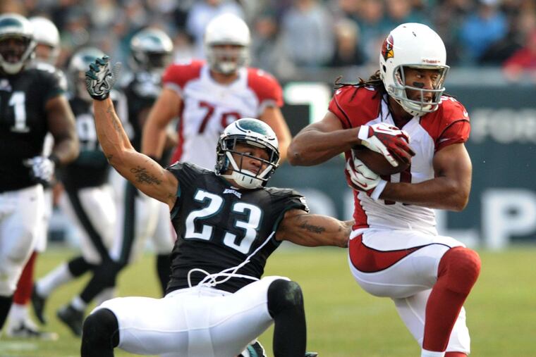 The Cardinals' Larry Fitzgerald breaking free on his wayto a touchdown against the Eagles in 2013 at Lincoln Financial Field. The Eagles won, 24-21.